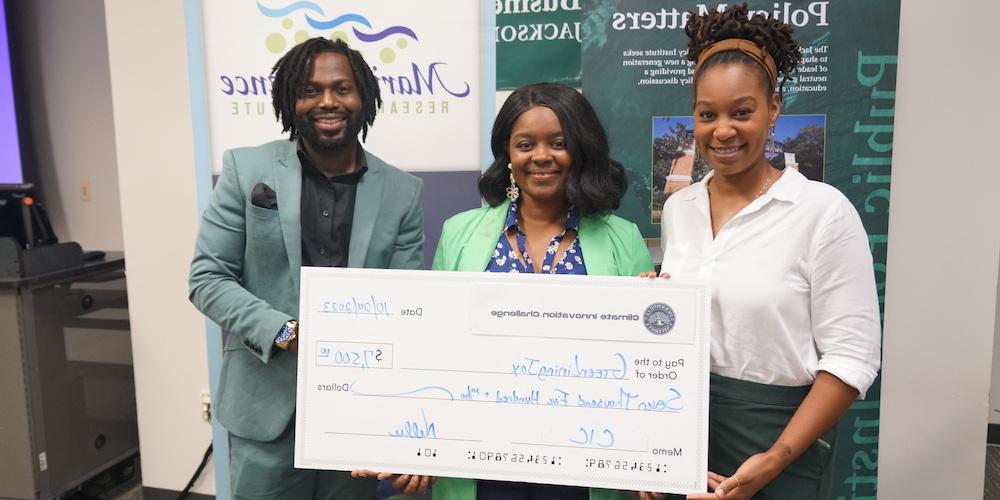 People holding giant check